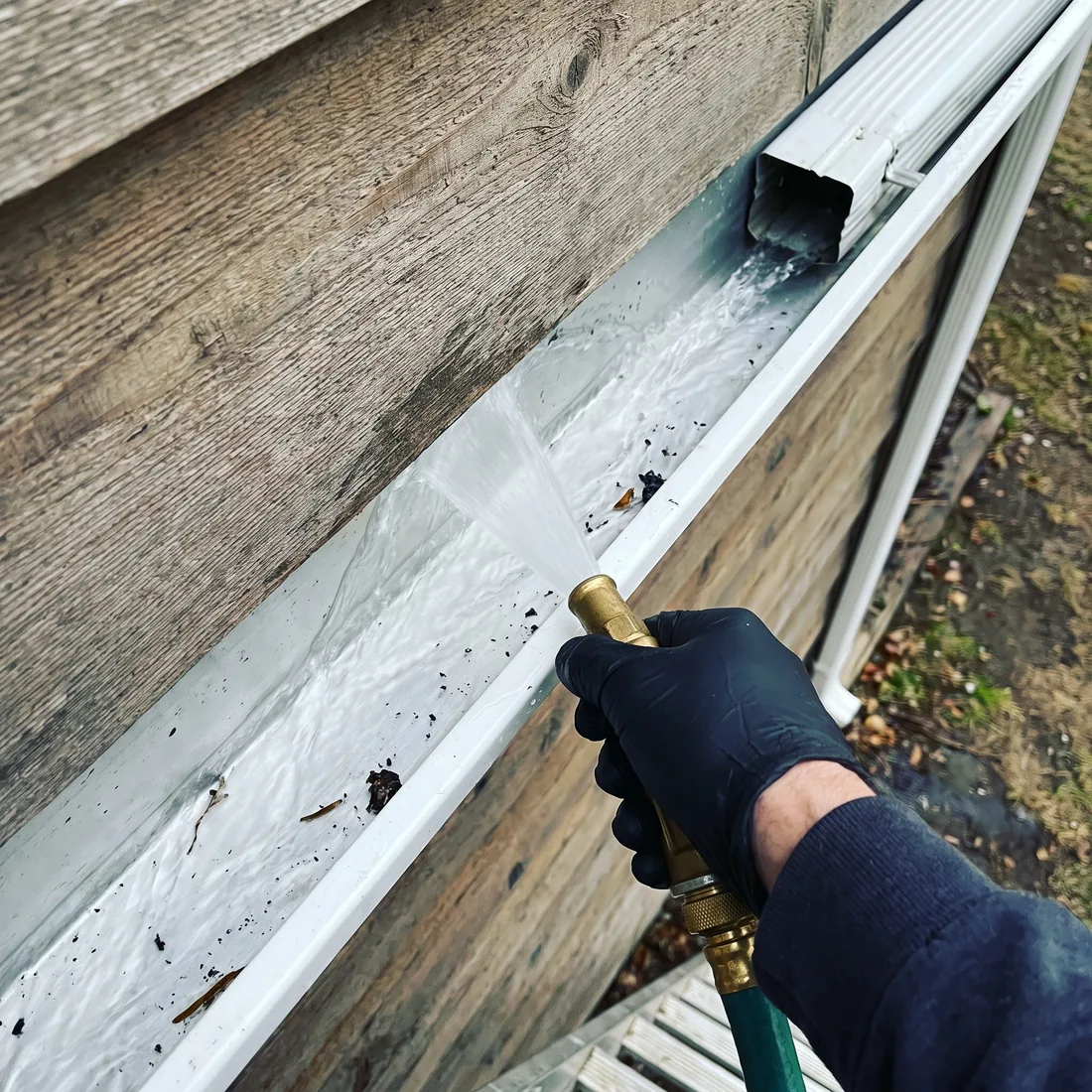 Reflekt crew working along a gutter line in the Treasure Valley