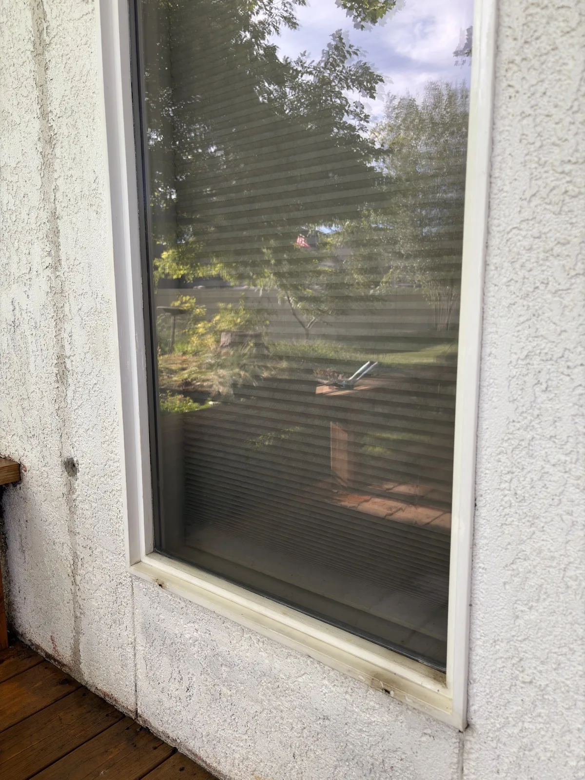 Crystal-clear window after Reflekt hard water stain removal in Boise, Idaho