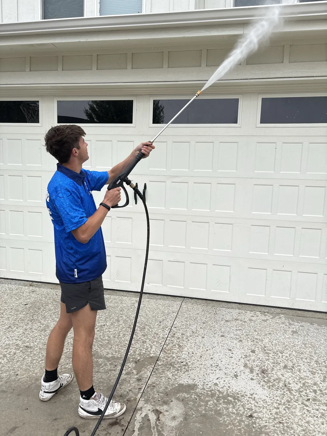 Reflekt crew pressure washing exterior surfaces with even passes in the Treasure Valley, Idaho