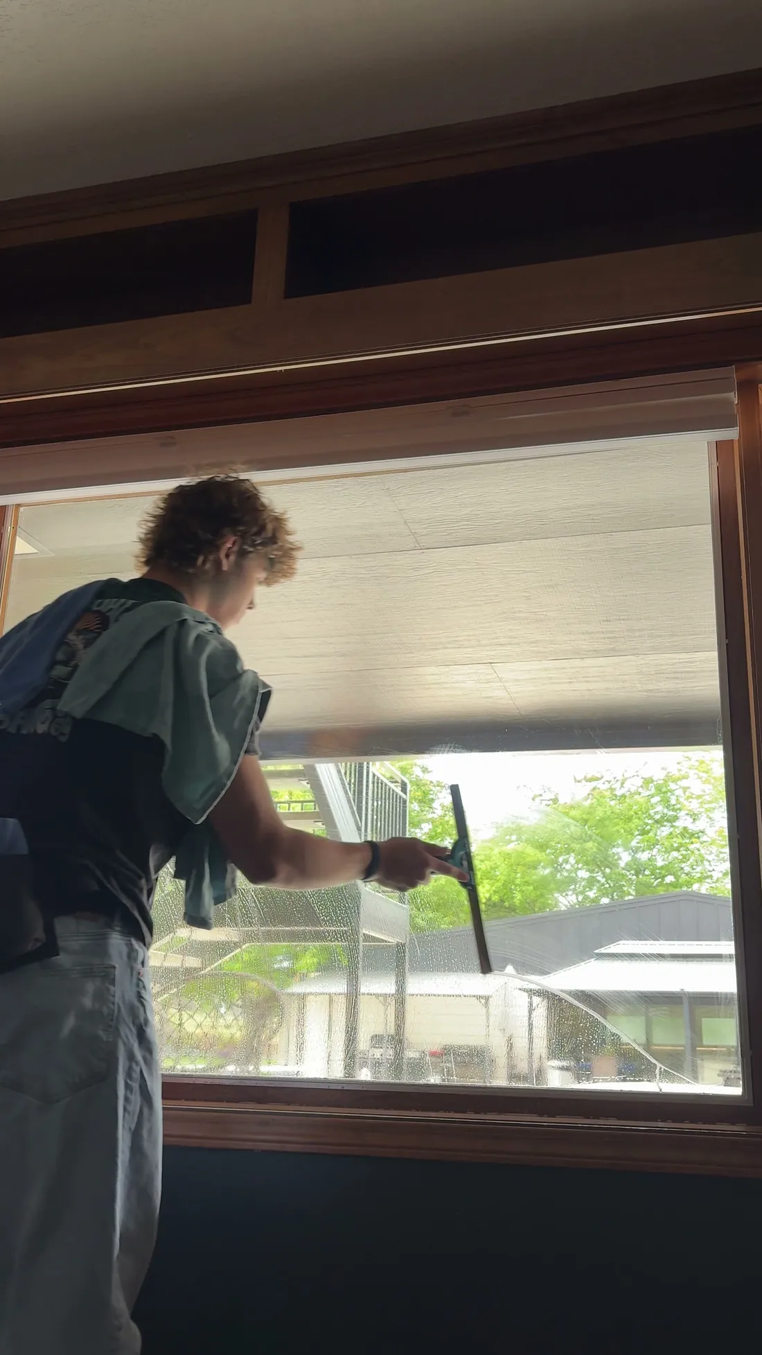 Reflekt crew squeegeeing interior glass in a Treasure Valley home